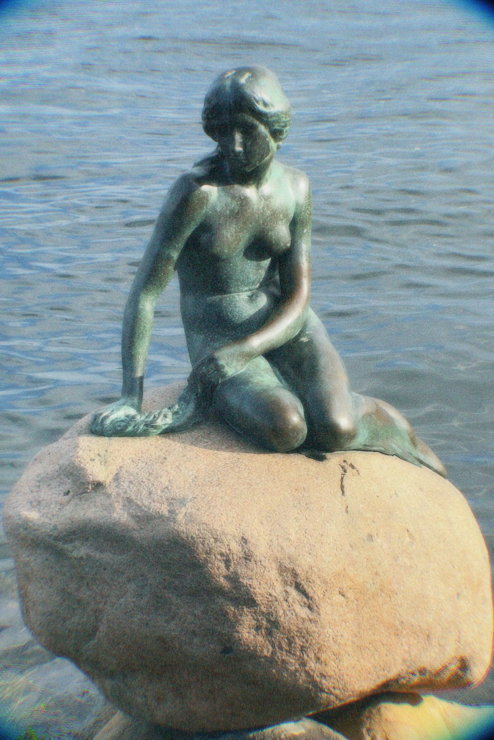 The Little Mermaid statue on her rock at the waterside, Copenhagen