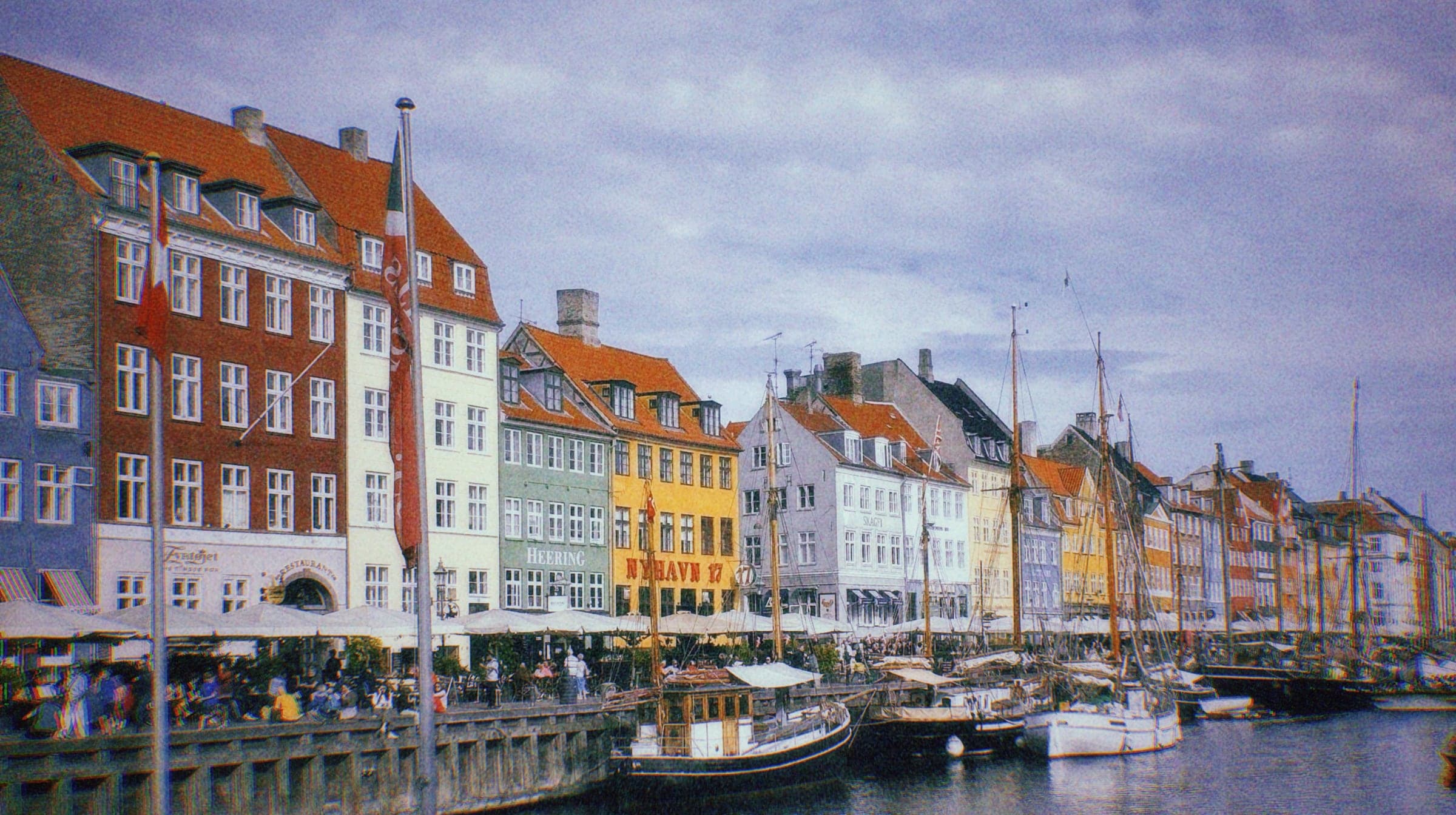 Coloured townhouses and moored boats along the Nyhavn canal, Copenhagen